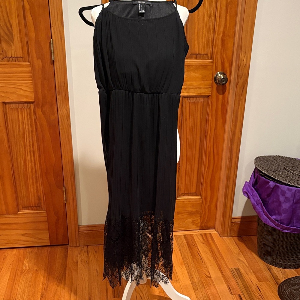 Forever 21 sleeveless black dress with adjustable straps, and lace on the bottom